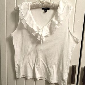 Ruffled sleeveless top with lace-up neckline